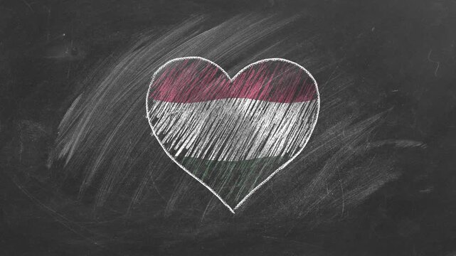 National flag of Hungary in heart shape  drawn with colored chalk on a blackboard. Hungarian language, learning Hungarian.