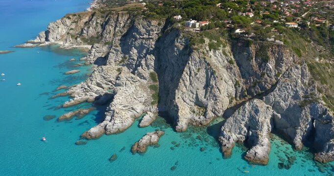 Aerial view of the Capo Vaticano promontory in Calabria, Italy. It is the outermost cape of the Coast of the Gods. It is made up of high white granite cliffs overlooking the turquoise and crystal sea.