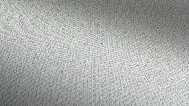 Clean white painting canvas featuring waves of texture and subtle weave