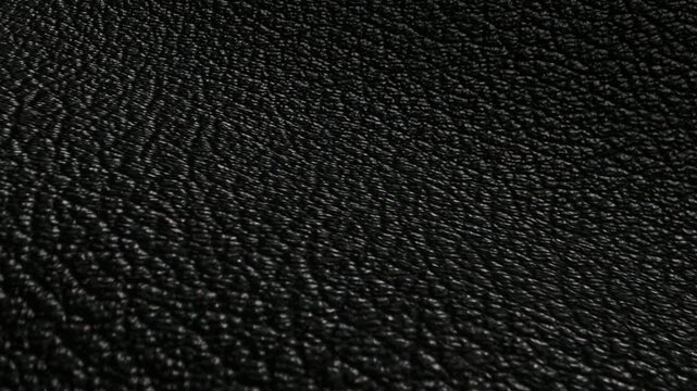 Black pebbled leather featuring waves of texture and bumpy grain