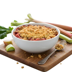 Rhubarb crumble served in a white bowl on a wooden board, with rhubarb stalks and a spoon, all set against a linen tablecloth.

