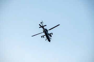helicopter is flying on isolated blue sky