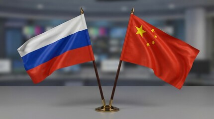Desktop display featuring two small, waving national flags representing the Russian Federation and the People's Republic of China symbolizing cooperation.