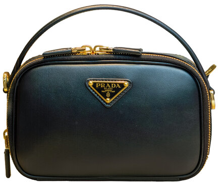 Sophisticated Odette mini bag in shiny black leather with black enamel Prada logo. Milan, Italy, February 9, 2026