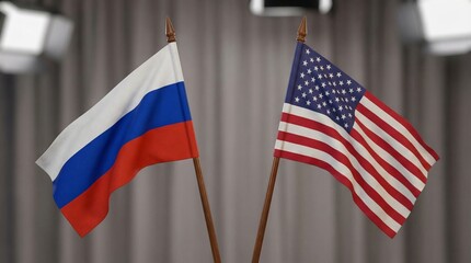 Close-up of two small national flags, the Russian Federation and the United States of America, standing side-by-side.