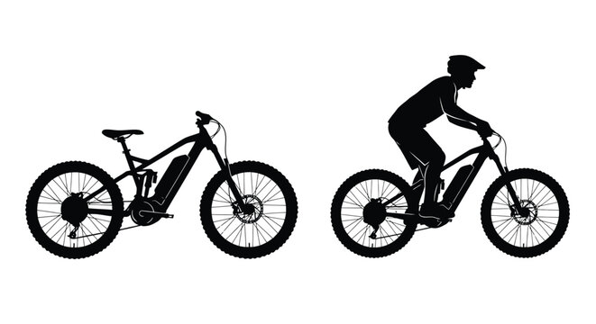 Silhouette of an electric mountain biker riding a full suspension bike