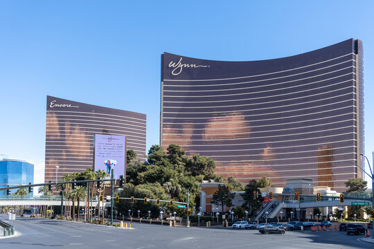 Las Vegas, Nevada, USA - March 2nd, 2024: Modern curved glass architecture Wynn Encore hotels Las Vegas city street view sunny afternoon