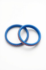 Fototapeta premium Two vibrant blue rings with red and white dotted patterns displayed together