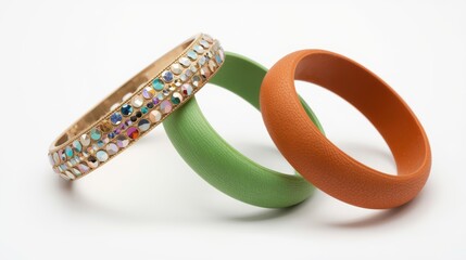 Three distinct rings displayed together showcasing different materials and designs