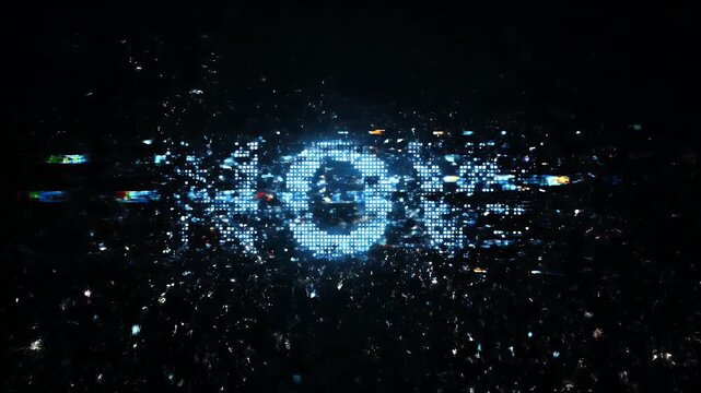 Pixelated Text Reveal with Digital Dispersal - The video shows a bright, pixelated letter "O" on a dark background, surrounded by a scattering of digital particles.