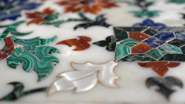 Intricate Floral Inlay Design on White Marble with Green Malachite and Red Carnelian Accents