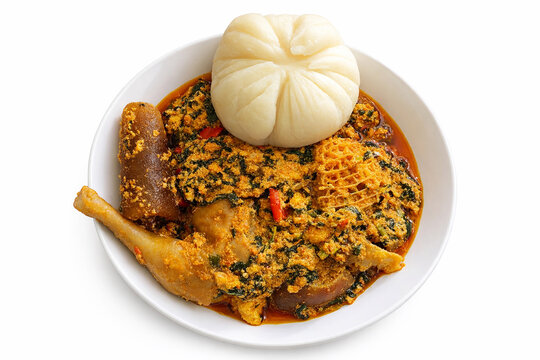 Nigerian Pounded Yam with Egusi Soup and Assorted Meat &ndash; Traditional West African Cuisine Isolated on White