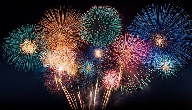 colorful fireworks on the black sky background with free space for text celebration and anniversary concept