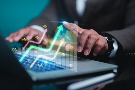 Business owners are analyzing growth using graphs that show rising spikes and percentage symbols, representing online economic growth and tax concepts.
