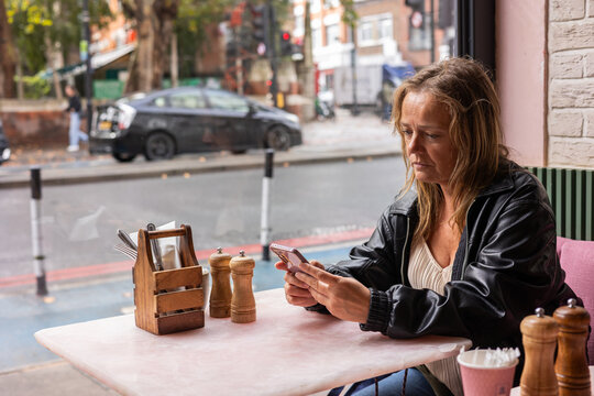 a woman having breakfast in London