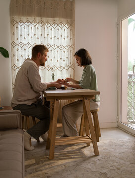 Man getting manicure at home 