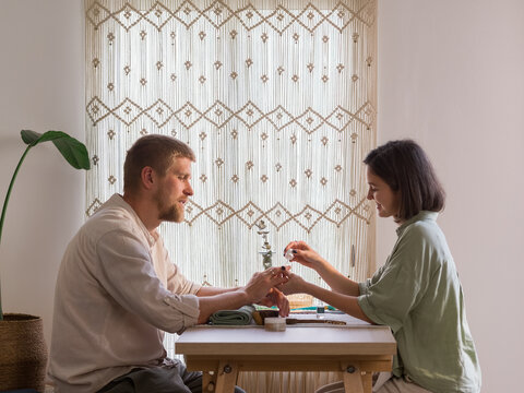 Couple enjoying time together during manicure session 