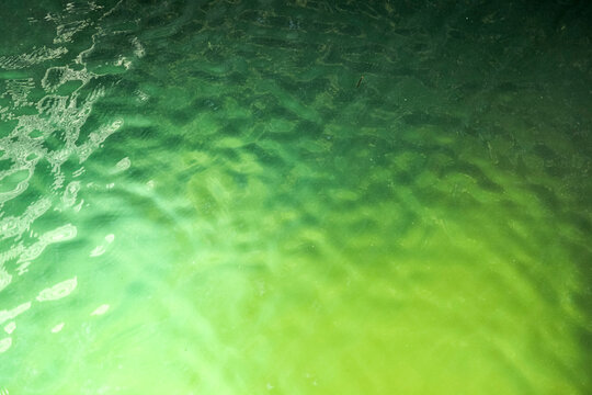 Textured green water with light gradient