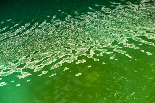 Water surface with geometric light reflections