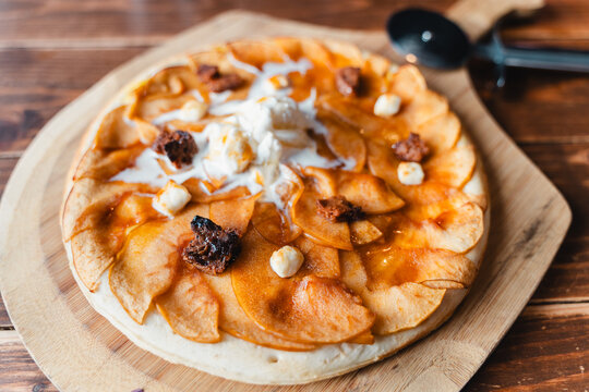 Rustic Autumn Apple Pie dessert on Wooden Board