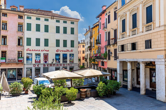 Vicenza, Italy - July 8, 2024: Piazza delle Erbe in the historic center of Vicenza, Italy. This picturesque square is known for its colorful buildings, outdoor cafes, and historic atmosphere.