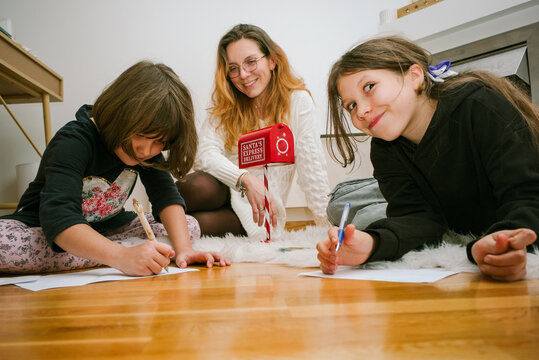 Kids Write Letters to Santa in Home Setting With Handmade Mailbox