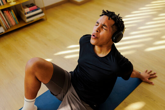 Man feeling exhausted during home workout