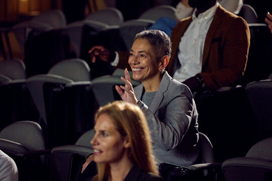 Businesswoman raises her hand for the word