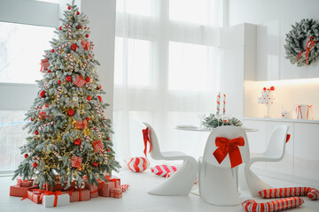 Fototapeta premium Elegant white room decorated for Christmas with a festive tree and gifts