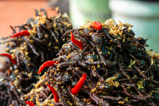 Fried Tarantula spiders with chillis for sale as snacks at Skun Market near Siem Reap, Cambodia
