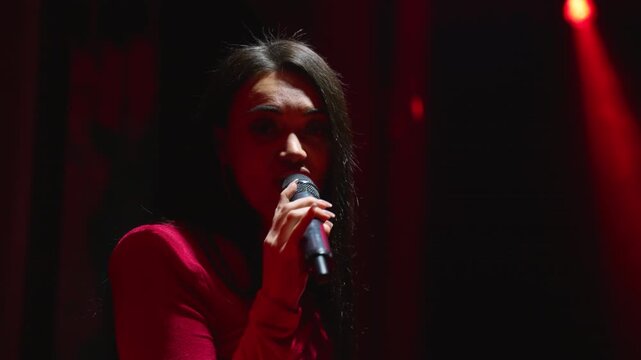 Talented female singer performing song on stage