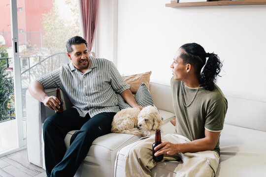 Friends drinking beer at home