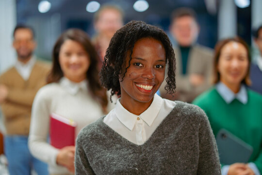 Smiling woman in group setting
