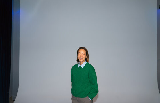 Person in front of blank wall
