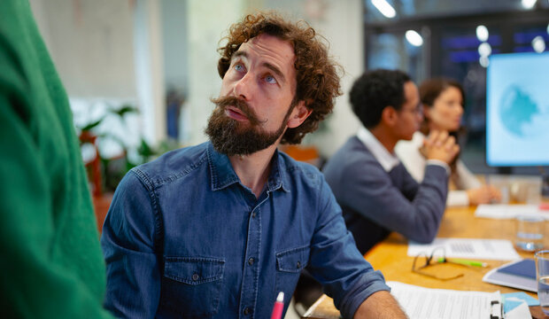 Meeting with team in office space
