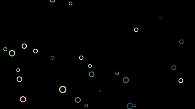 An abstract pattern featuring circular shapes in various sizes on a dark background