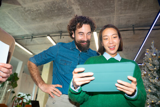 Friends share device at a gathering
