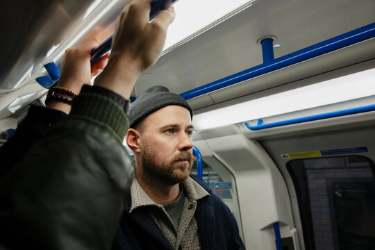 Man traveling on London Underground subway train
