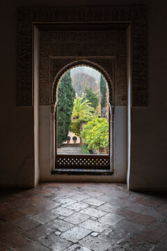 Arabic arch framing landscape at the Alhambra