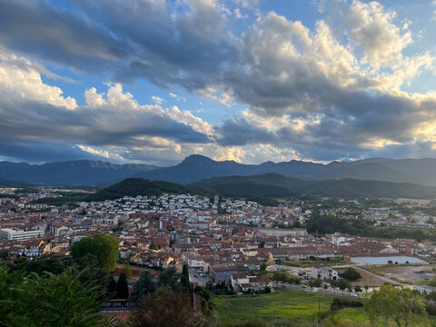 Olot city landscape seeing mountains and cloudy sky