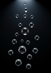 transparent bubbles floating on a pitch black background. 