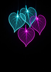 Colorful tropical leaves glowing on a black background.
