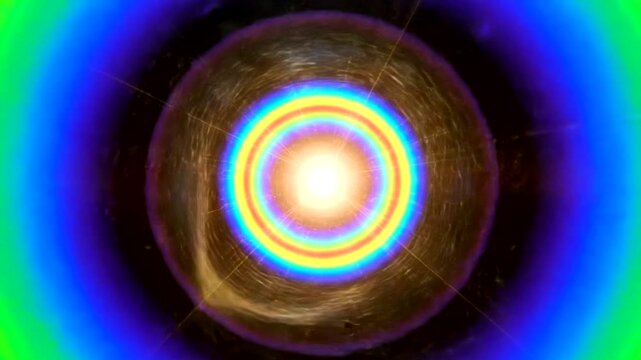 Abstract glowing orb with rainbow rings and blue aura.