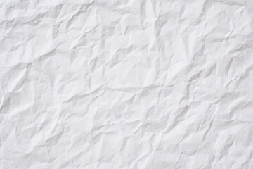 Obraz premium A blank white sheet of paper with fine wrinkles covering the entire surface, isolated