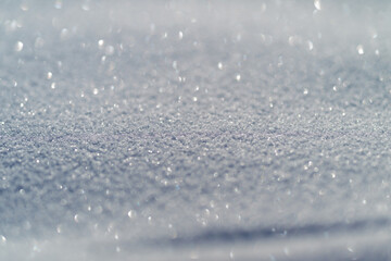 Obraz premium Snow surface glints beneath sunlight, Frosty crust dissolves as sunlight warms snow, Seasonal thaw creates shimmering snow layers ideal for climate change messages