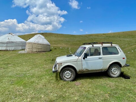 Nomadic lifestyle with traditional yurts and Lada Niva at Song Kul Lake, Kyrgyzstan, 17.07.2025.