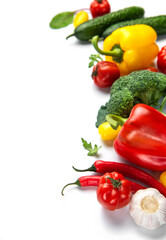 Fresh organic vegetables creating healthy eating concept on white