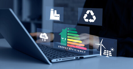 Energy efficiency concept. Energy efficiency rating icon on virtual screen for energy efficient house building rate label audit. © AYSIA