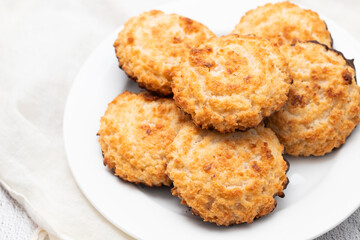Coconut cookies with chocolate on plate