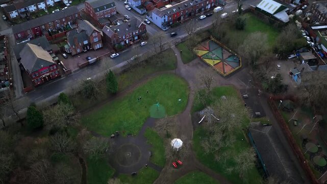 Aerial video of Heywood Park in Bolton, showcasing its community green spaces, bandstand, and refurbished playground.